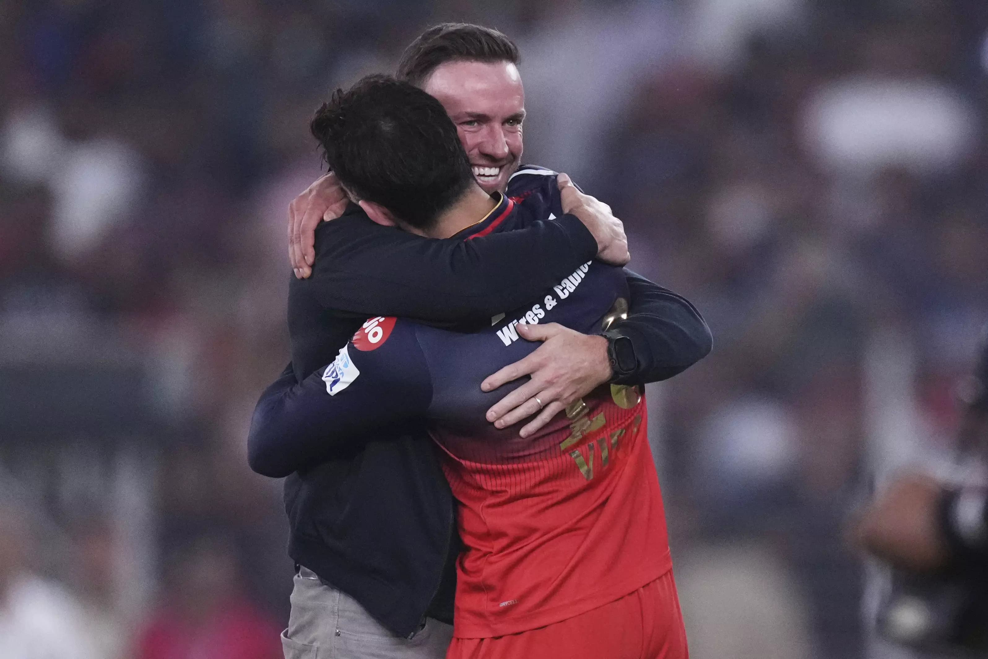 Royal Challengers Bangalore Secure Finals Spot with Emotional Embrace